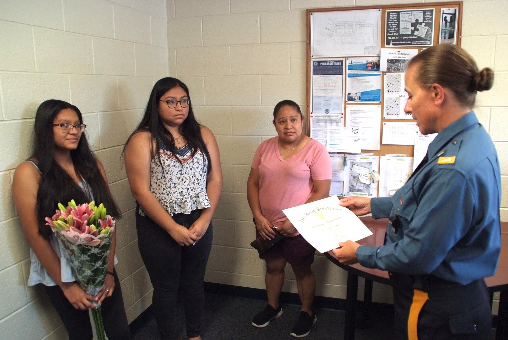 Tuckerton-New-Jersey-troopers-recognized-Conchita-for-her-actions-during-a-medical-assist-image-with-family